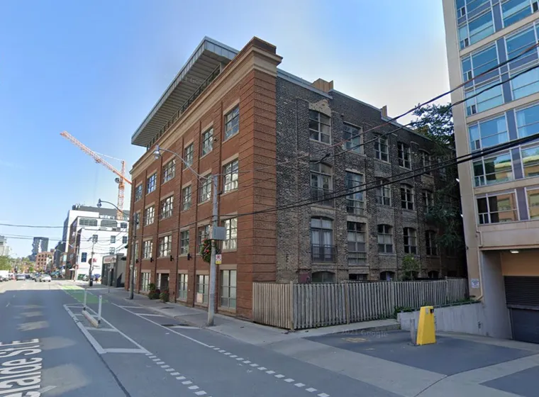 Urban street view with historic and modern buildings.