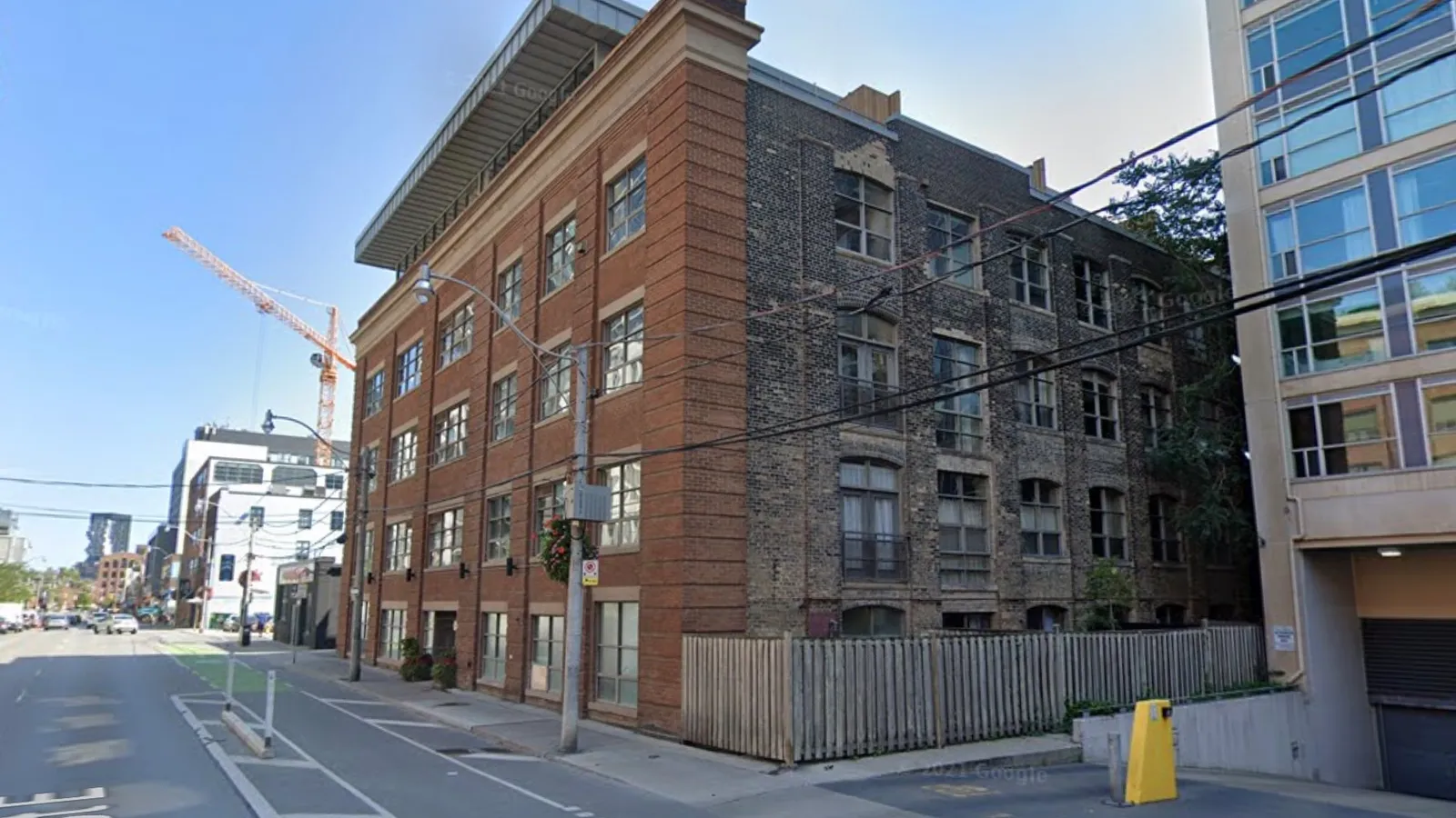 Urban street view with historic and modern buildings.