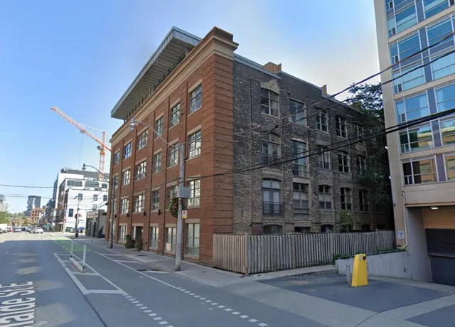 Urban street view with historic and modern buildings.