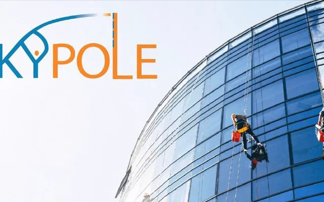 Rope-access window cleaning on a building