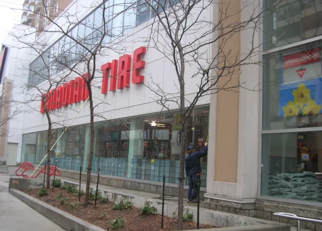 Canadian Tire store exterior on cloudy day.