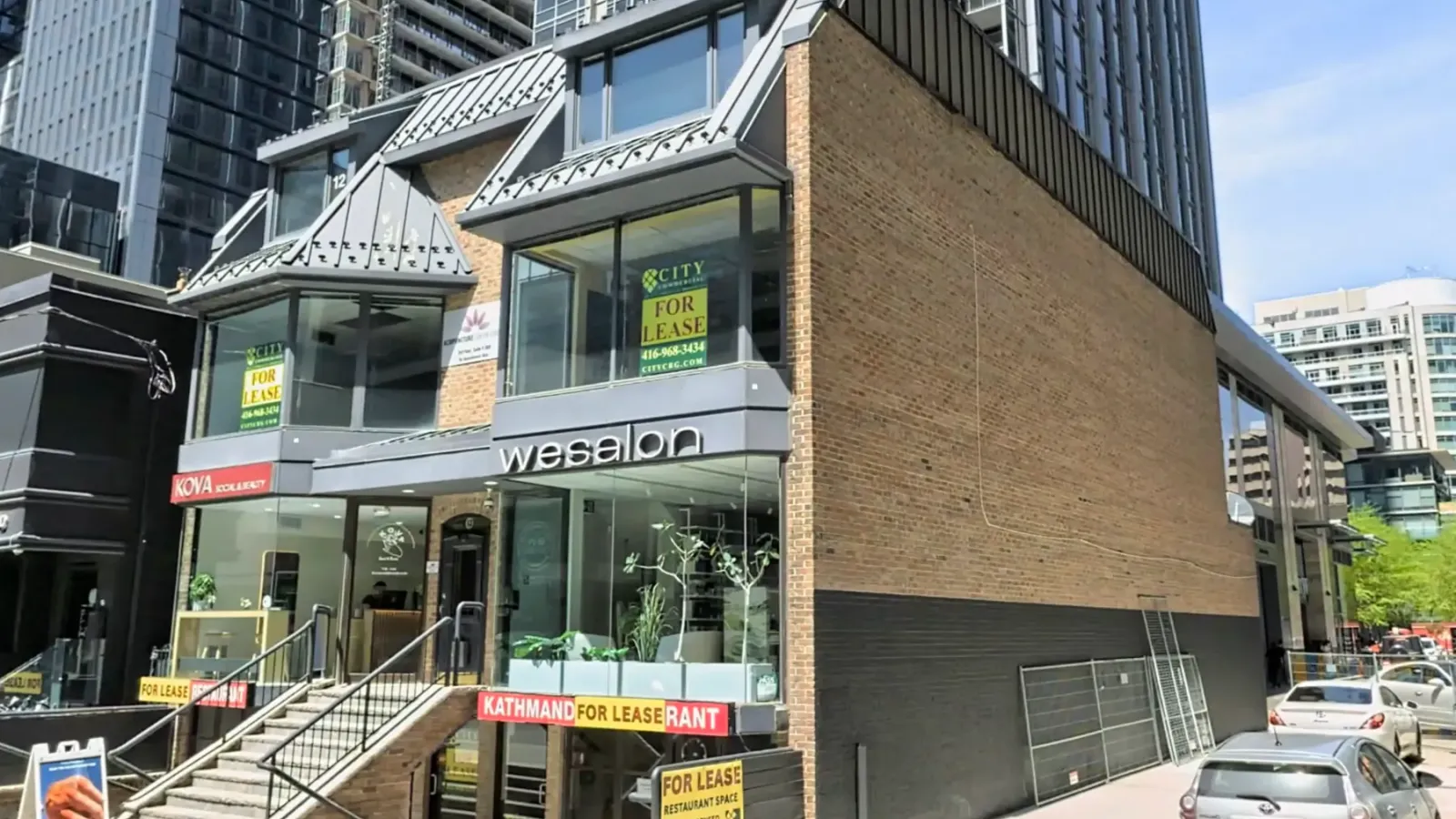 Exterior commercial window cleaning project at 12 Cumberland Street in Yorkville, Toronto