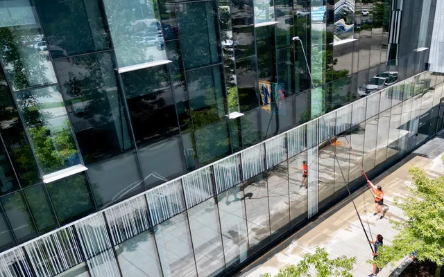 Two SKYPOLE window cleaners keeping a commercial property looking great.