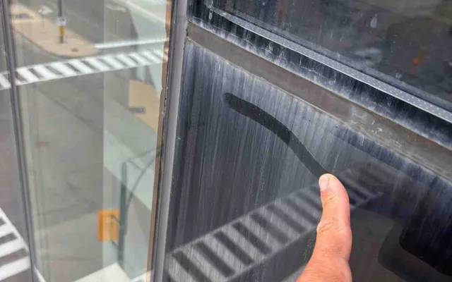 finger rubbing stains of a window