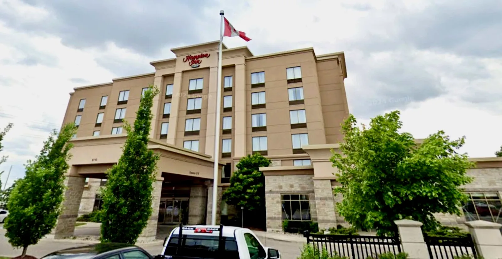 Hampton Inn hotel exterior with Canadian flag in Brampton