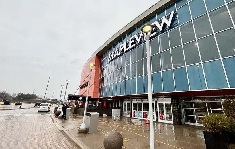 Exterior of Mapleview Mall entrance on cloudy day having the windows cleaned