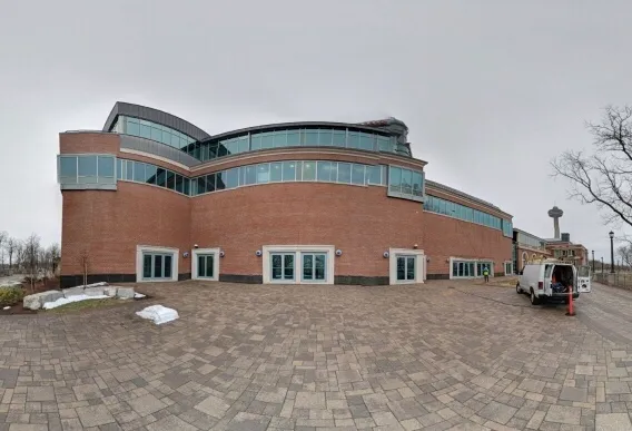 Modern brick building with curved architecture and glass windows