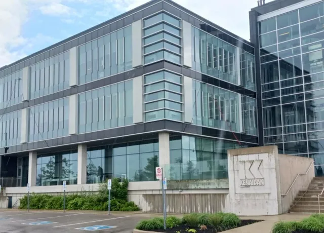Windows being cleaned on modern office building