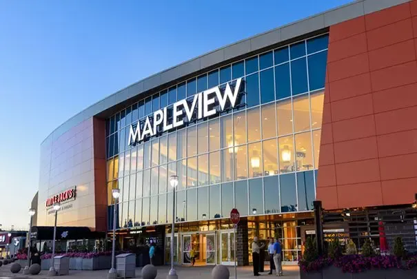 Exterior of Mapleview Shopping Center at dusk