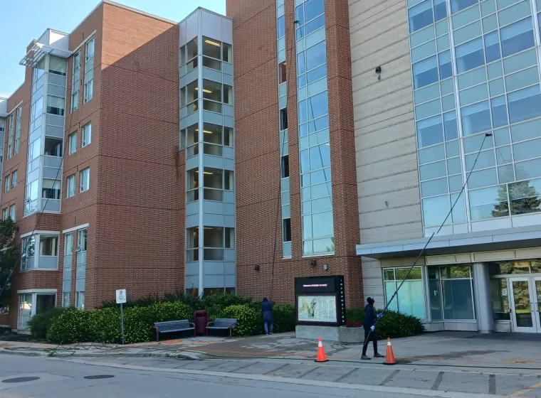 Wide view of Skypole cleaning upper-storey windows at McMaster University’s Mary E. Keyes Residence.