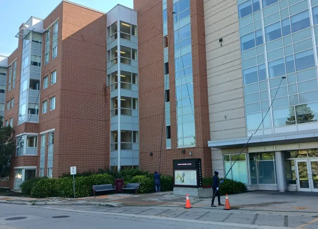 Wide view of Skypole cleaning upper-storey windows at McMaster University’s Mary E. Keyes Residence.
