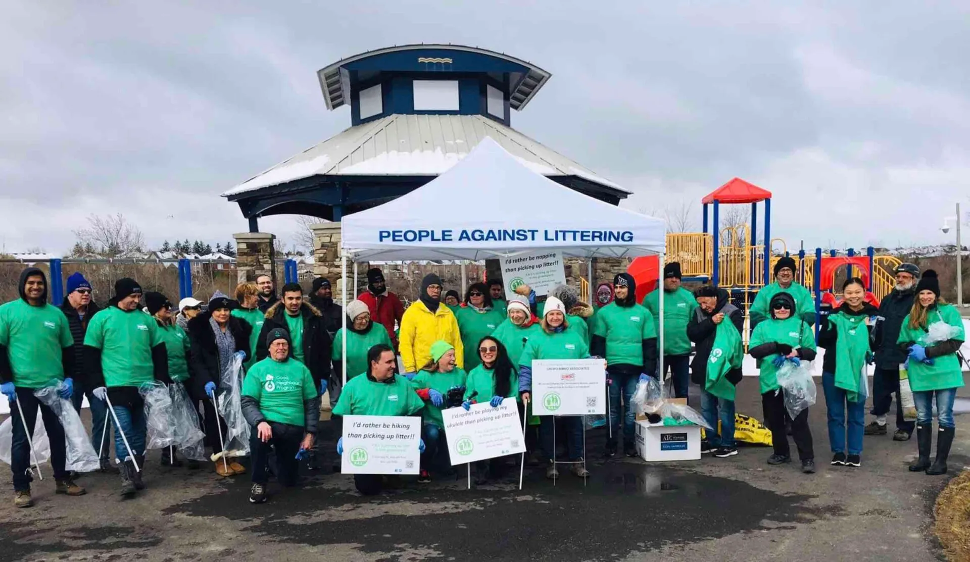 Community group in green shirts at anti-littering event