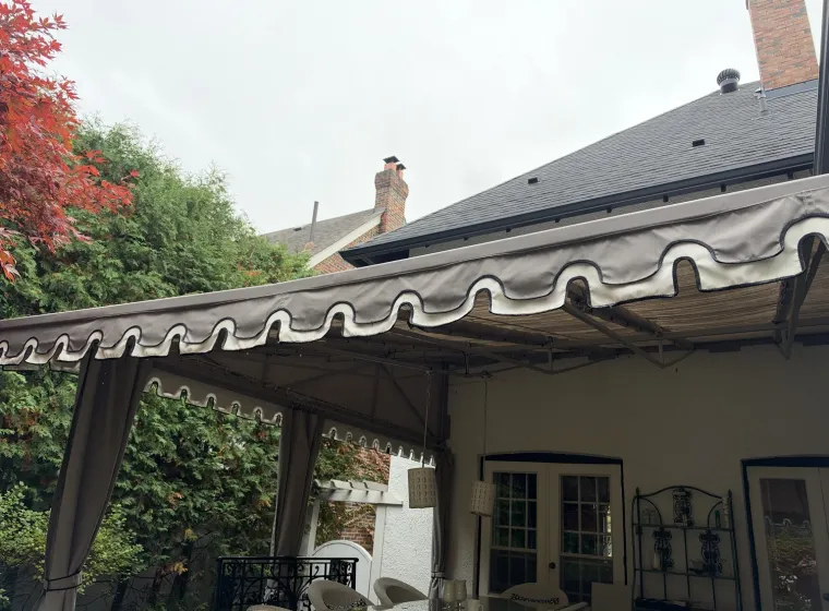Large residential patio awning with decorative fabric valance at a home in Rosedale, Toronto, professionally cleaned by SKYPOLE Inc.