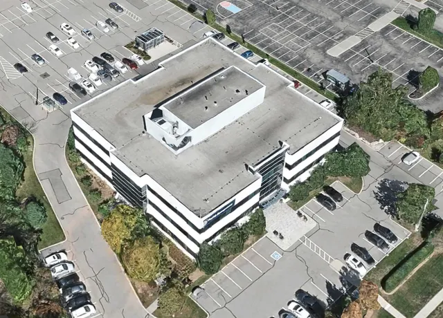 Aerial view of a multi-story parking at 435 North Service Rd W, Oakville