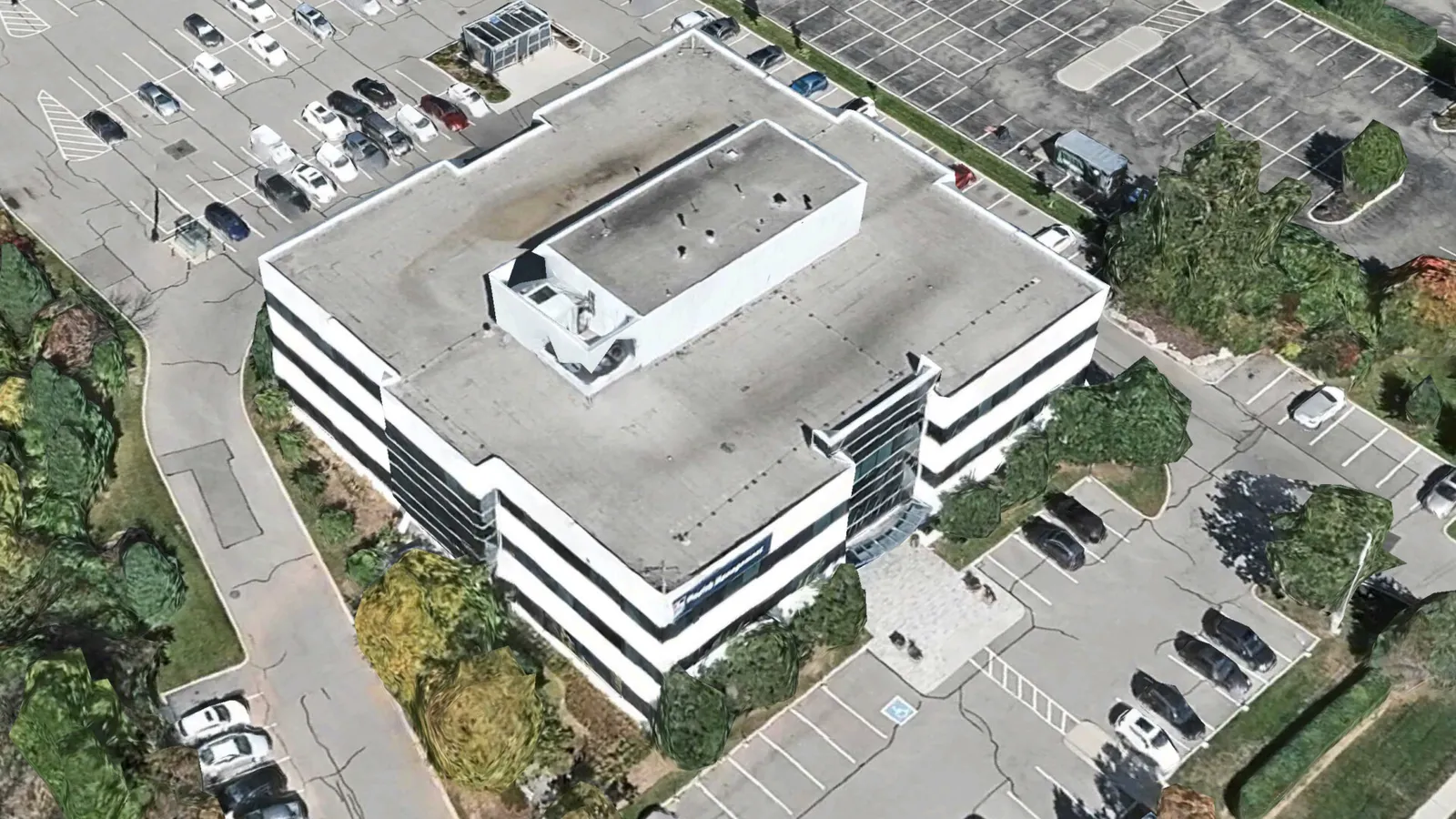 Aerial view of a multi-story parking at 435 North Service Rd W, Oakville