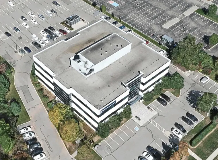 Aerial view of a multi-story parking at 435 North Service Rd W, Oakville