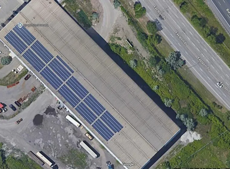 Aerial view of solar panels on industrial building roofs