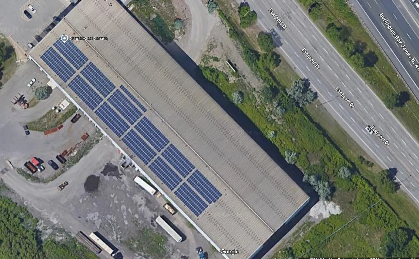Aerial view of solar panels on industrial building roofs