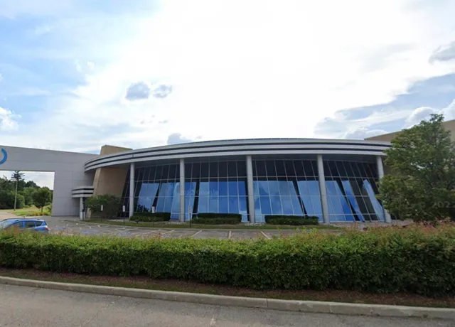 Shaw company modern headquarters building under sunny sky