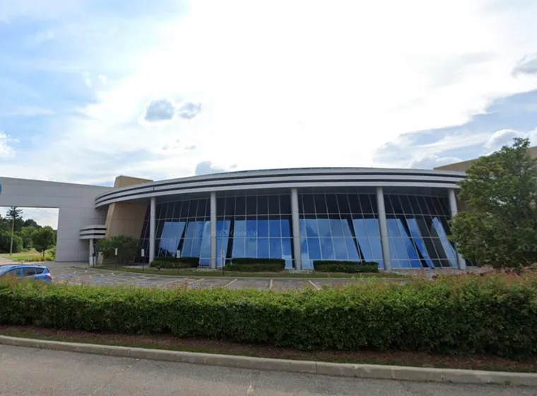 Shaw company modern headquarters building under sunny sky