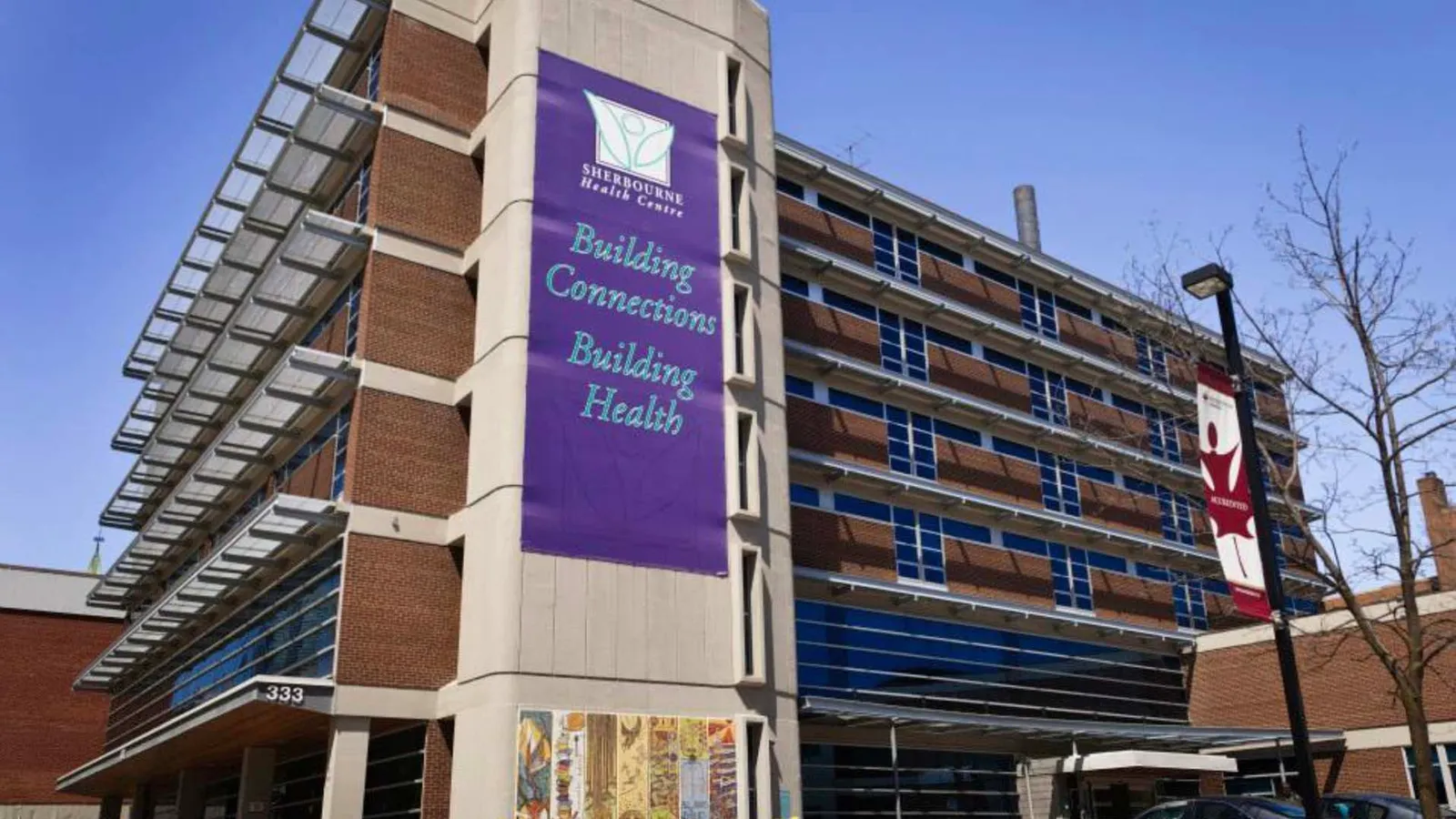 Sherbourne Health Centre with banner on building exterior