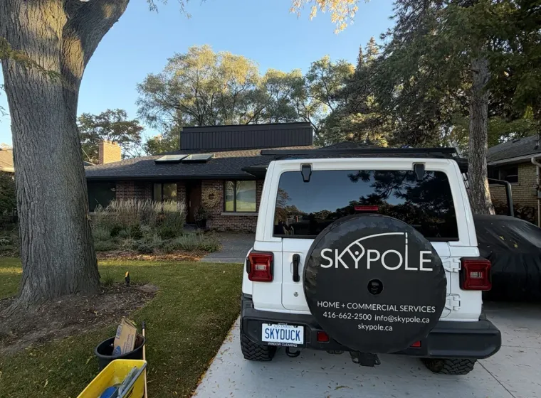 SKYPOLE Window Cleaning vehicle parked outside an Etobicoke home during residential exterior window, skylight and eavestrough cleaning.
