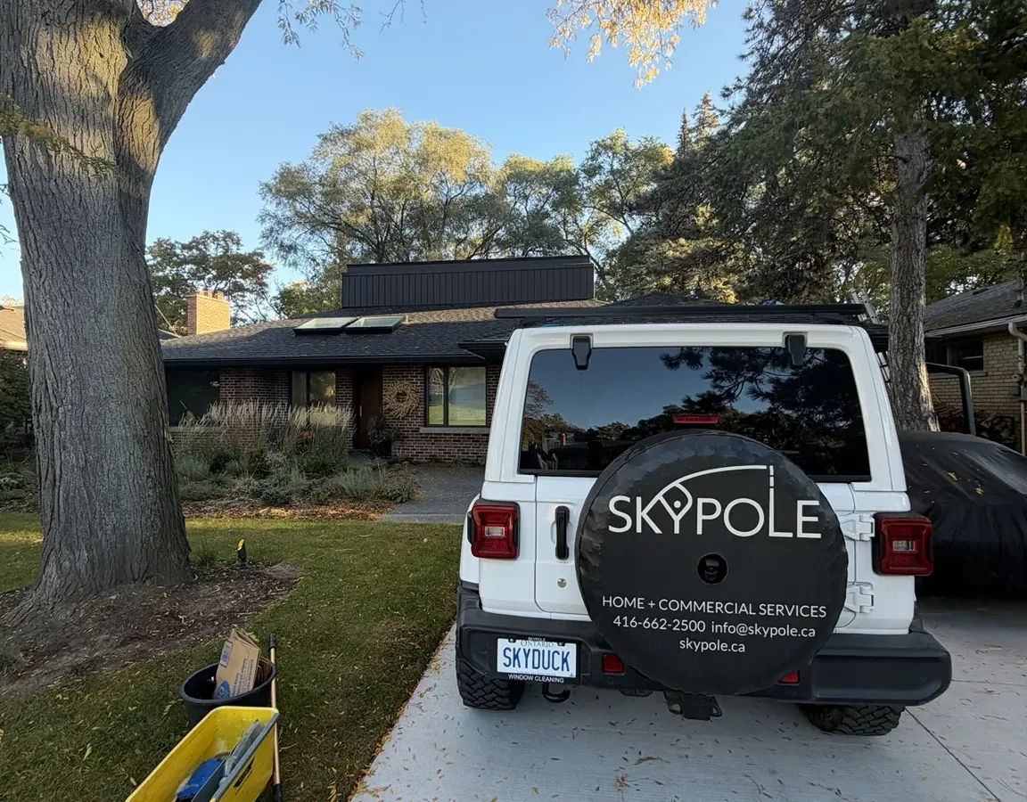 SKYPOLE Window Cleaning vehicle parked outside an Etobicoke home during residential exterior window, skylight and eavestrough cleaning.