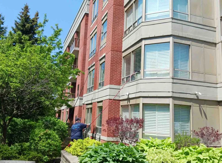 Red brick building with cleaning the windows