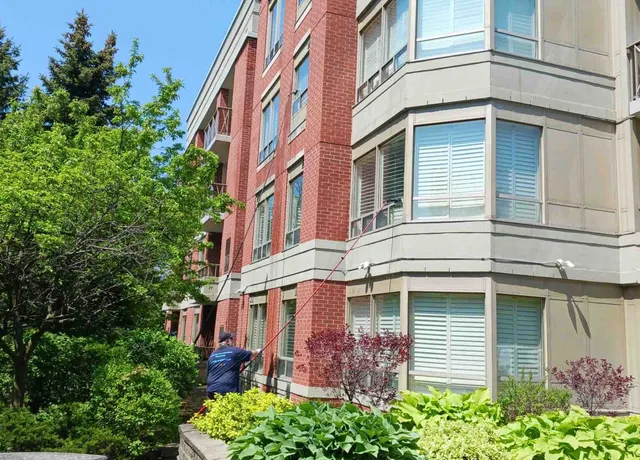 Red brick building with cleaning the windows
