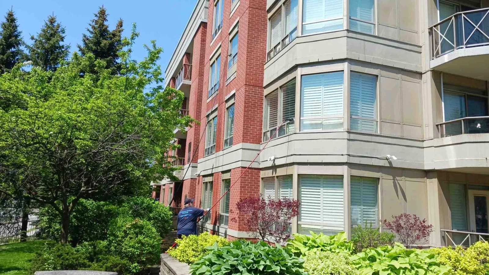 Red brick building with cleaning the windows