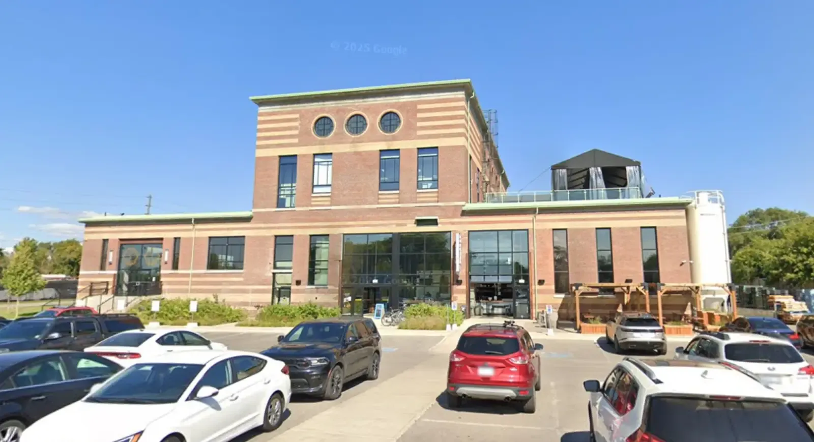 Exterior window cleaning at commercial building on Symes Road in Toronto using water-fed pole system by Skypole Window Cleaning