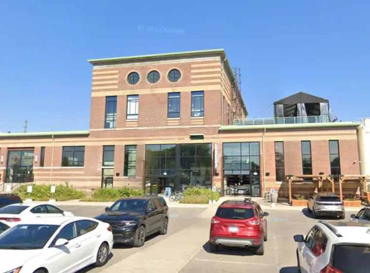 Exterior window cleaning at commercial building on Symes Road in Toronto using water-fed pole system by Skypole Window Cleaning