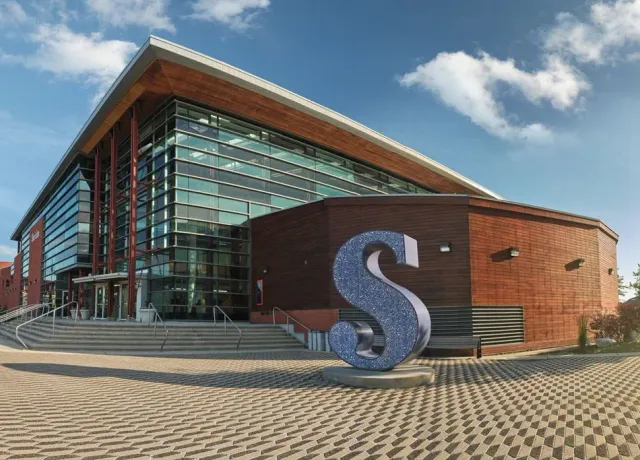 Modern building with large metallic sculpture, Sheridan Trafalgar Campus