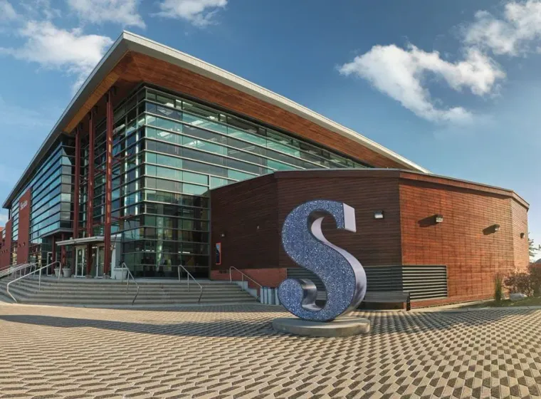 Modern building with large metallic sculpture, Sheridan Trafalgar Campus