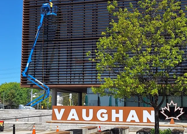 SKYPOLE safely cleaning the exterior façade of Vaughan City Hall using a boom lift and controlled work zone.