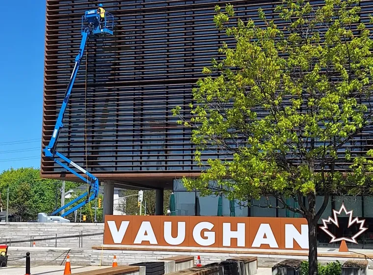 SKYPOLE safely cleaning the exterior façade of Vaughan City Hall using a boom lift and controlled work zone.