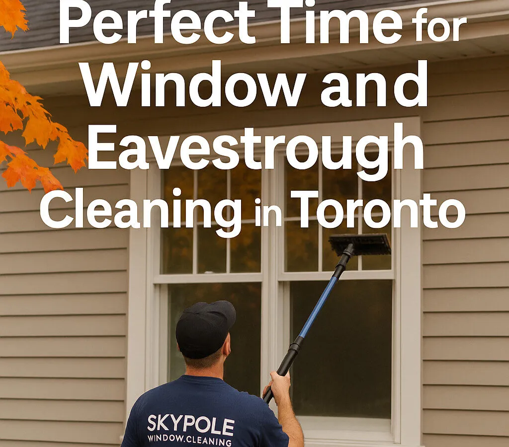 Worker cleaning house windows during autumn in Toronto