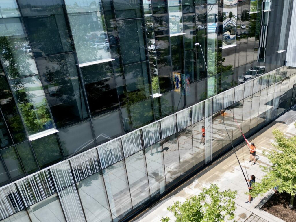 Two SKYPOLE window cleaners keeping a commercial property looking great.