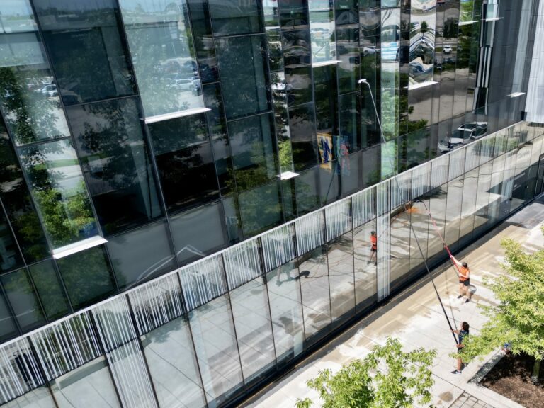Two SKYPOLE window cleaners keeping a commercial property looking great.