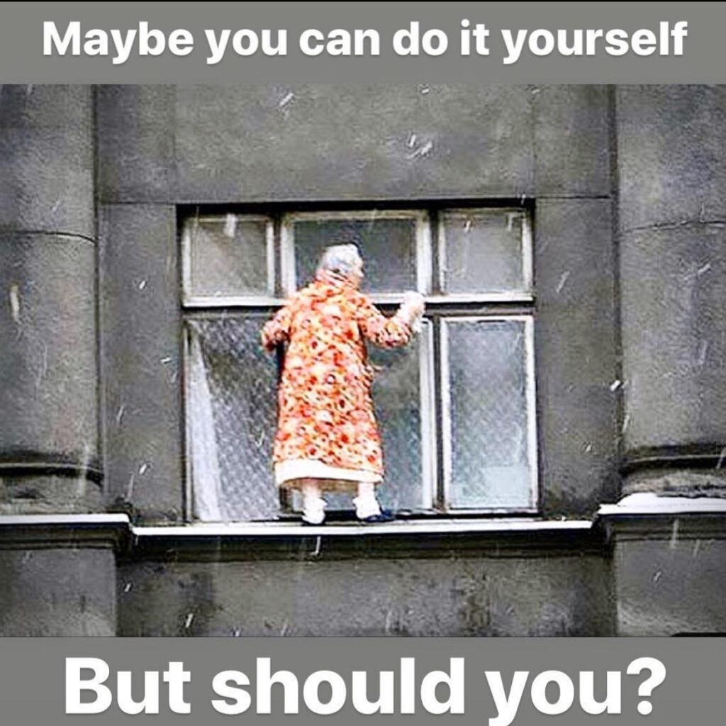 Should I clean my own windows? A old lady in a very scary way cleaning a window.