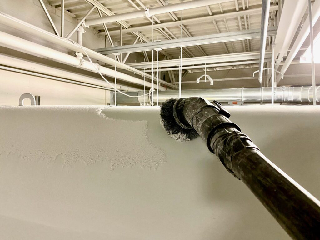 A vacuum collecting high dust from pipes and fans.