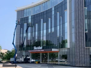 Worker using lift at Sheridan College Hazel McCallion Campus.