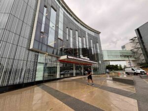 Man cleaning the windows of a college in Mississauga