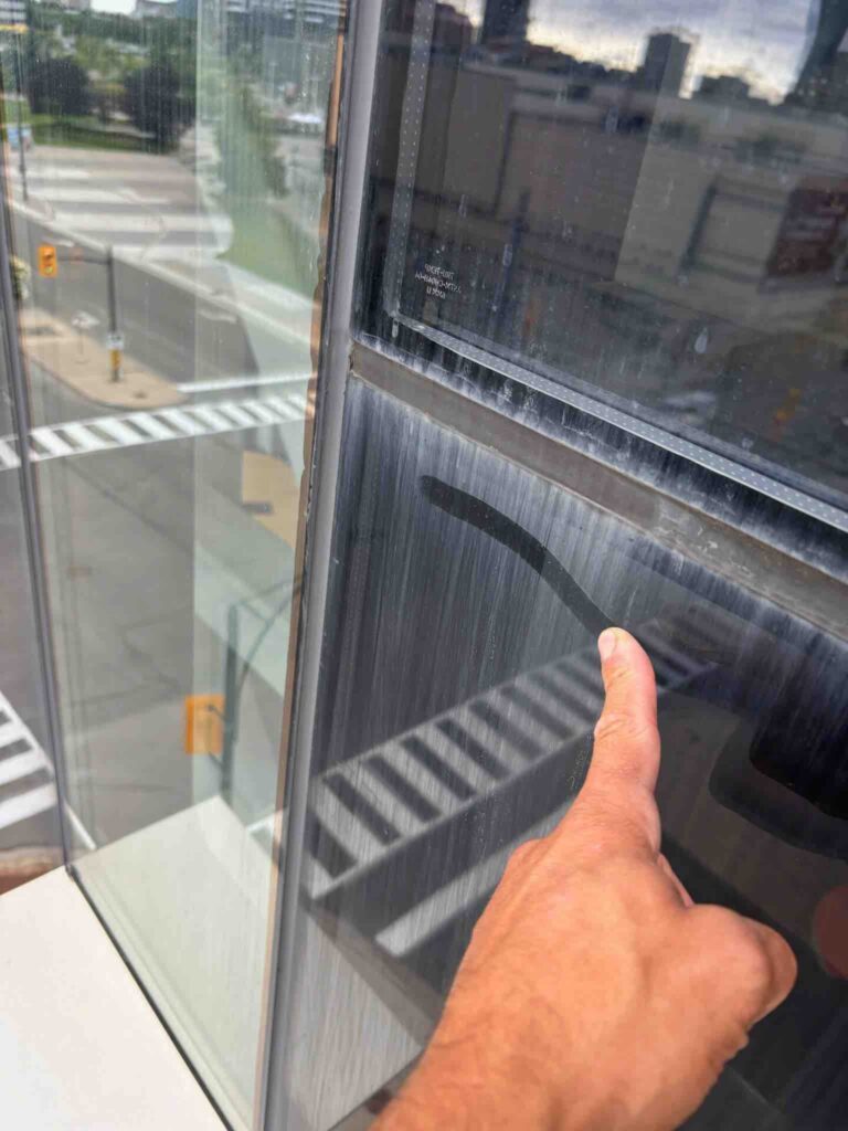 finger rubbing stains of a window