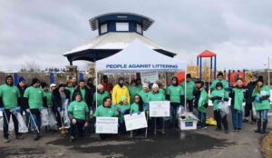 Community group in green shirts at anti-littering event