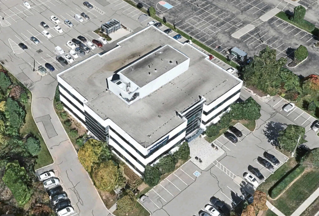 Aerial view of a multi-story parking at 435 North Service Rd W, Oakville