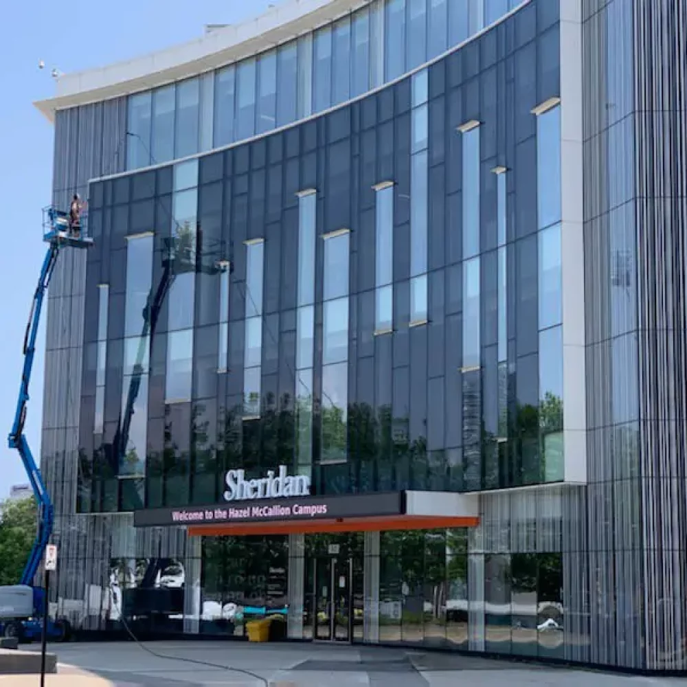 Worker using lift at Sheridan College Hazel McCallion Campus.