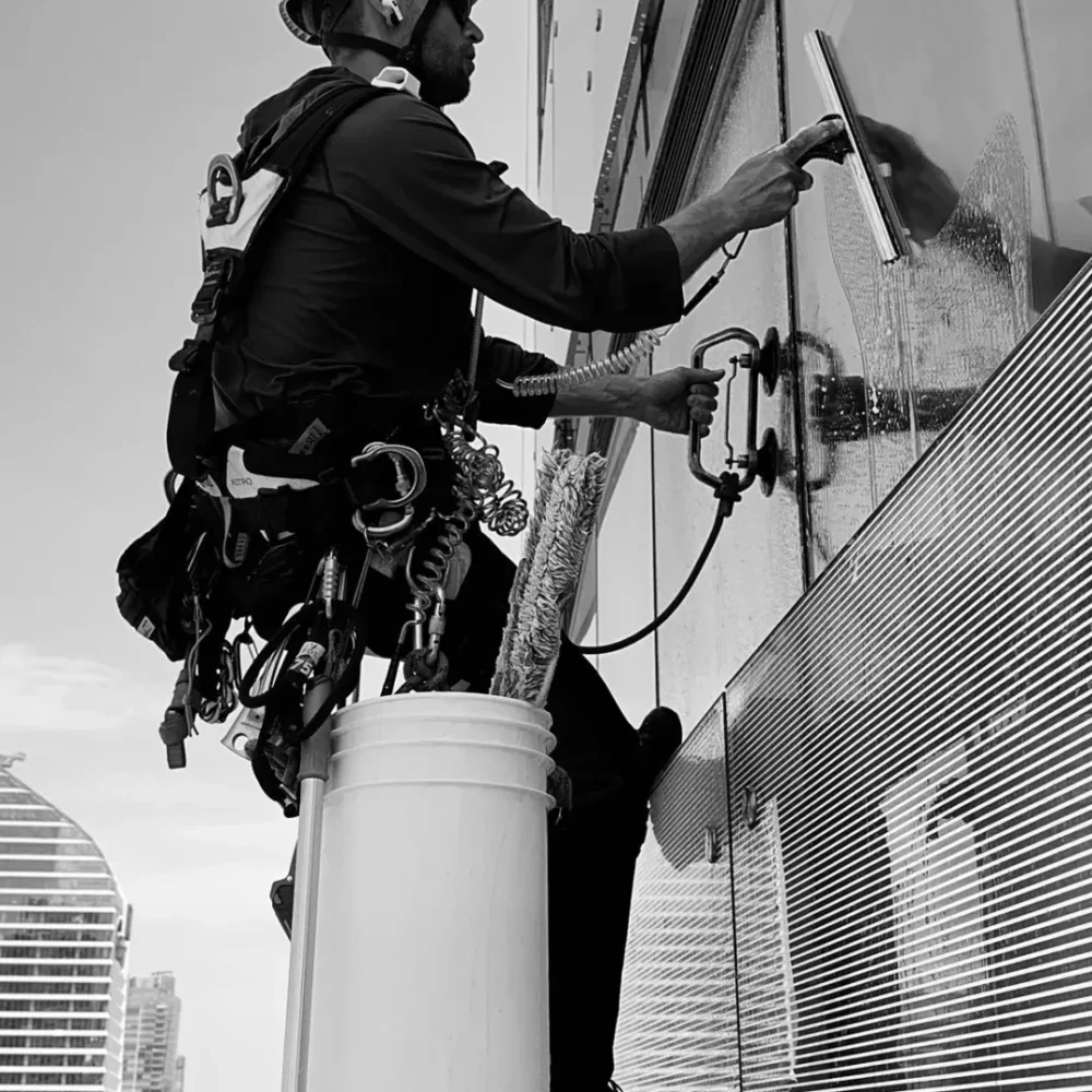 Window washer working on high-rise building facade