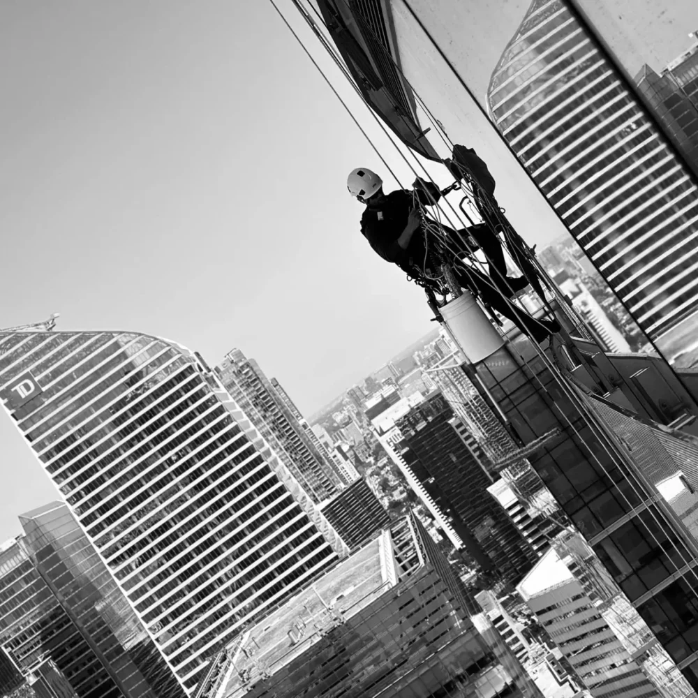 Window washer working on high-rise building facade